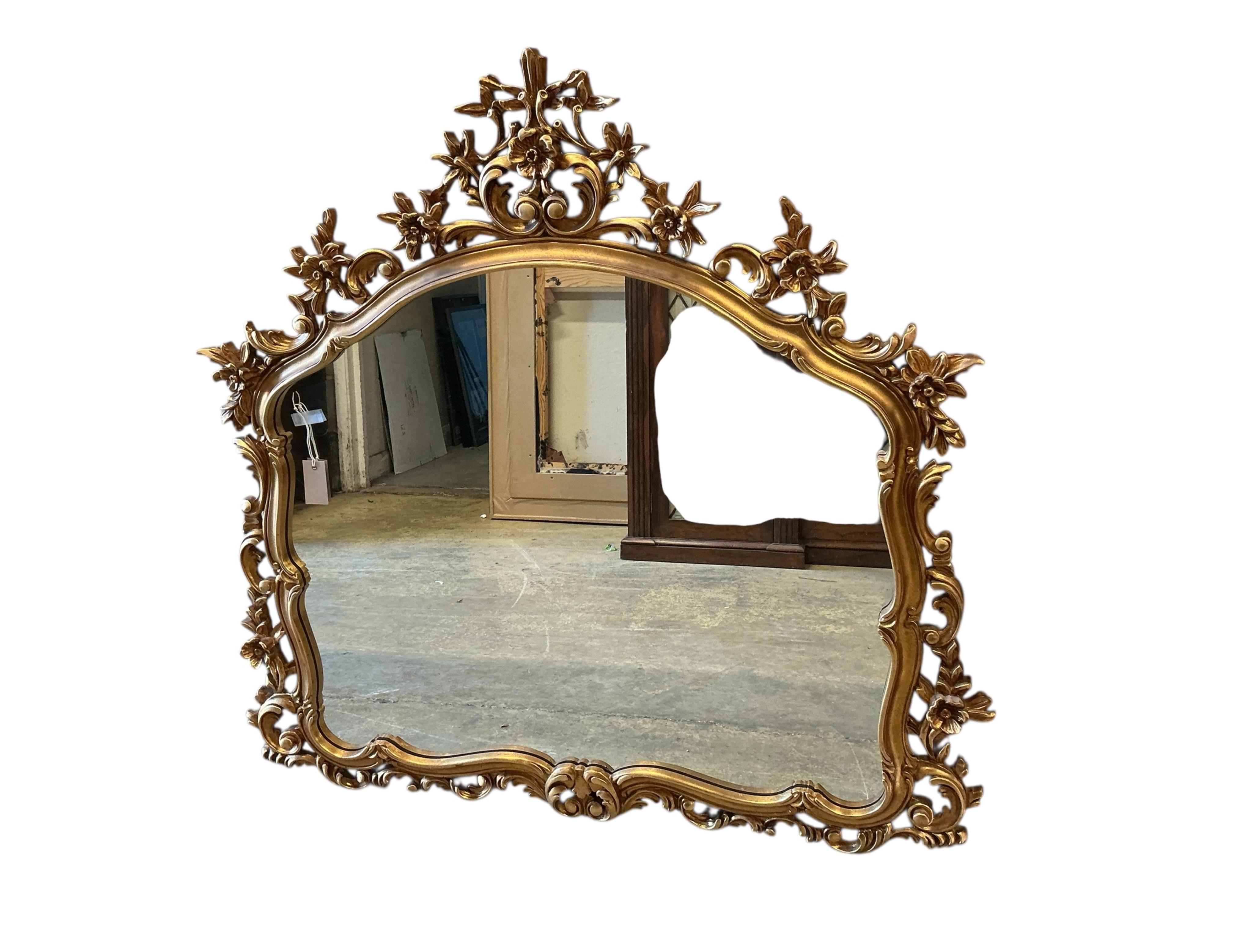 A Victorian style gilt composition wall mirror, width 114cm, height 116cm